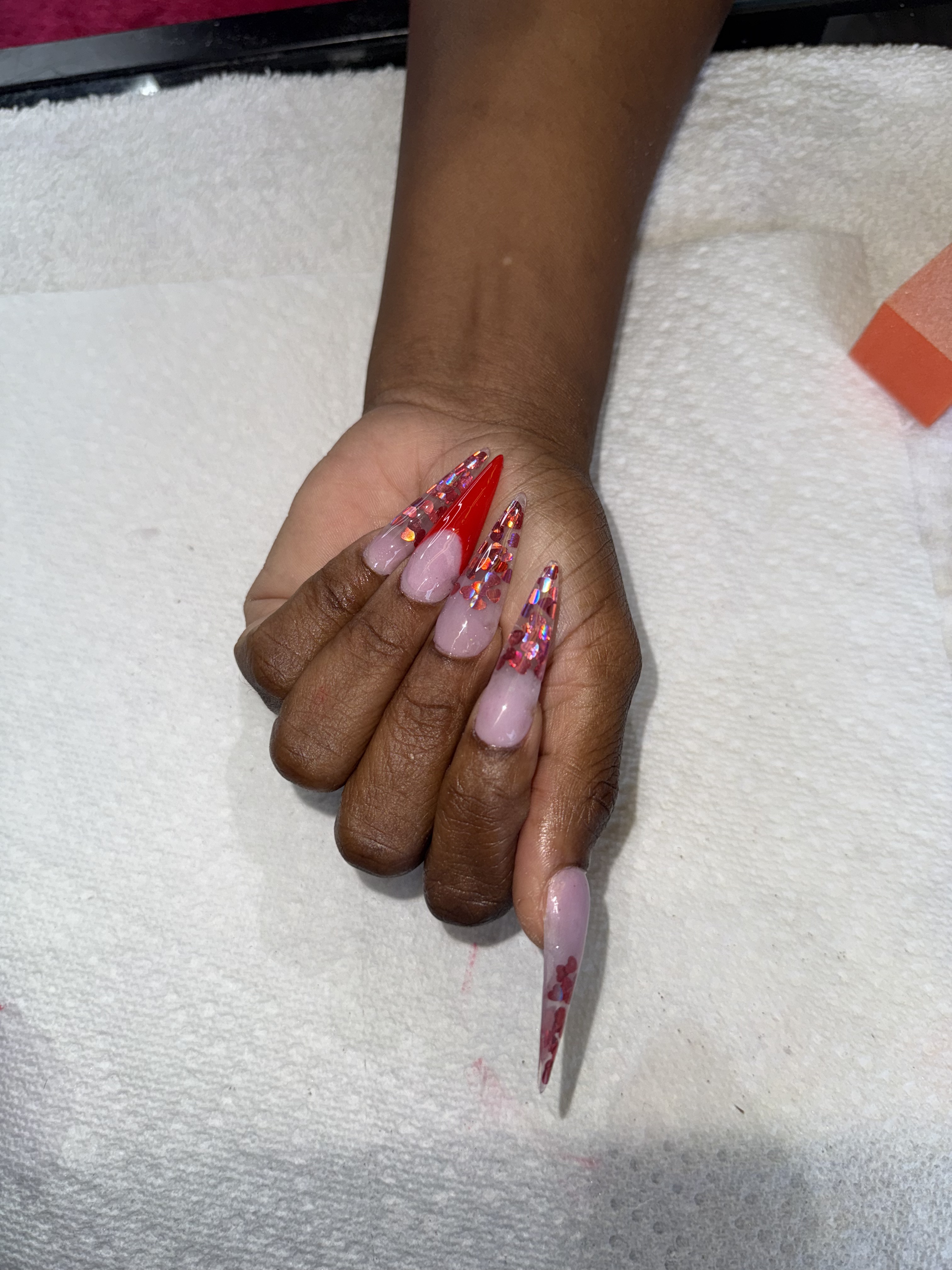 luxury chic stiletto acrylic ombre full set with red hearts in Aventura north miami by mobile nail tech service